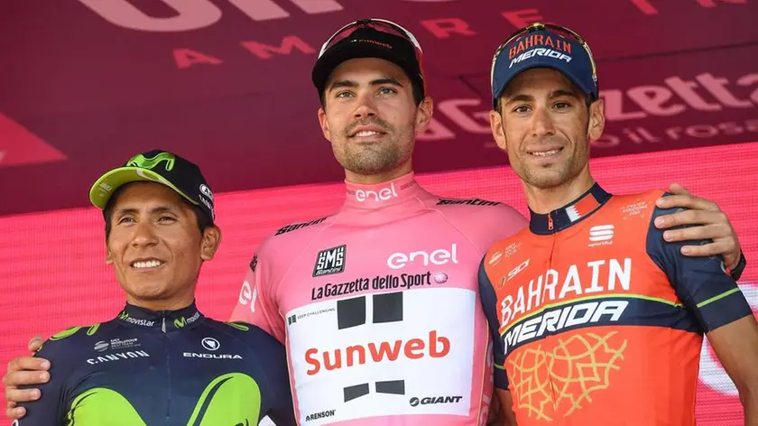 Dutch rider Tom Dumoulin (C) of the Sunweb Team celebrates on the podium his overall win flanked by second placed Colombian Nairo Quintana (L) of Movistar and third placed Italian Vincenzo Nibali of Bahrain-Merida team after the 21st and last stage of the 100th Giro d'Italia cycling race, in Milan, Italy, 28 May 2017..ANSA/ALESSANDRO DI MEO