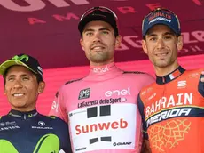 Dutch rider Tom Dumoulin (C) of the Sunweb Team celebrates on the podium his overall win flanked by second placed Colombian Nairo Quintana (L) of Movistar and third placed Italian Vincenzo Nibali of Bahrain-Merida team after the 21st and last stage of the 100th Giro d'Italia cycling race, in Milan, Italy, 28 May 2017..ANSA/ALESSANDRO DI MEO
