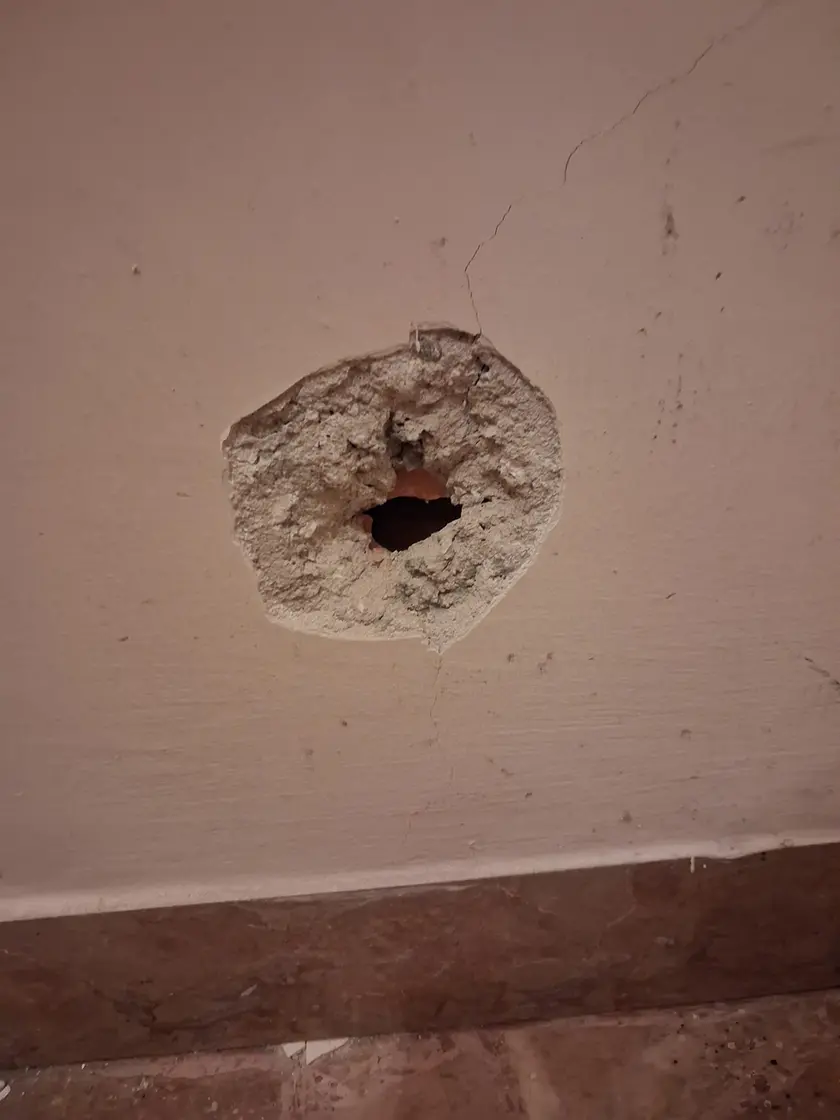 Le picconate sul muro