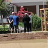 I vicini di casa davanti al condominio della tragedia (foto Pòrcile)
