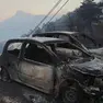 Le carcasse delle auto distrutte dall'incendio in Croazia (Ansa)