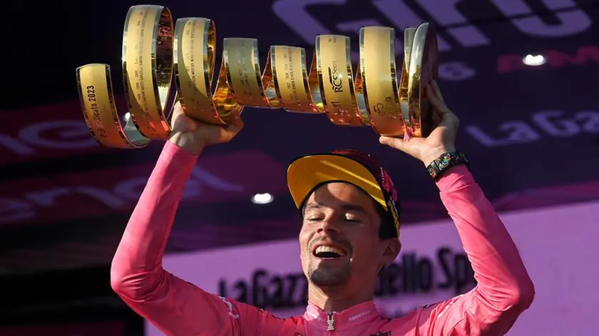 Slovenian rider and winner Primoz Roglic, celebrates with the trophy after winning the 2023 Giro d'Italia cycling race, Rome, Italy, 28 May 2023. ANSA/RICCARDO ANTIMIANI