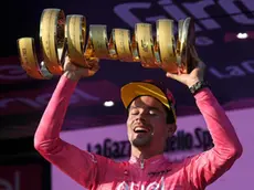 Slovenian rider and winner Primoz Roglic, celebrates with the trophy after winning the 2023 Giro d'Italia cycling race, Rome, Italy, 28 May 2023. ANSA/RICCARDO ANTIMIANI