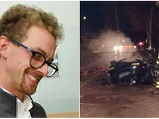 Luca Gazzola, 29 anni, e a fianco la sua auto distrutta
