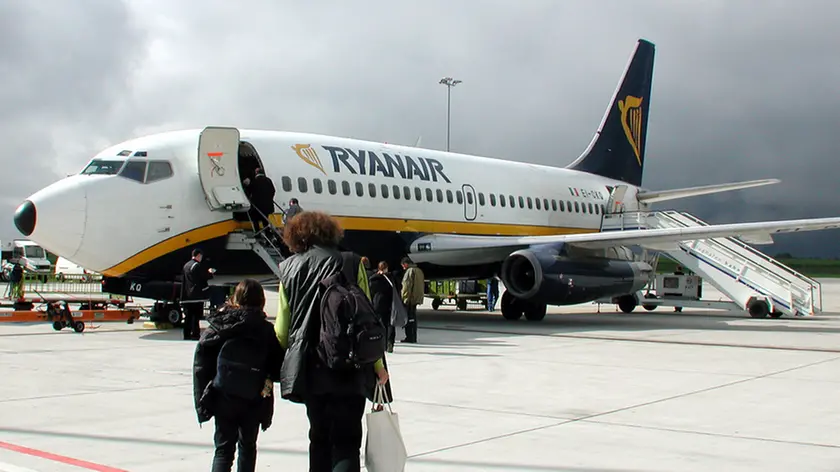 A Ryanair Boeing 737 is shown at the Hahn airport, western Germany, on Sept. 16. 2001. Europe's largest low-cost airline Ryanair said Thursday, Sept. 13, 2007 it wants to increase routes to two of Milan's airports.Ryanair said it plans to invest US$1.2 billion (860 million) to open routes at Milan's main international airport, Malpensa, and expand its presence at the low-cost hub Orio al Serio. The company will discuss its offer in a meeting with Malpensa officials on Friday. (AP Photo/Udo Weitz/File)