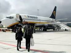 A Ryanair Boeing 737 is shown at the Hahn airport, western Germany, on Sept. 16. 2001. Europe's largest low-cost airline Ryanair said Thursday, Sept. 13, 2007 it wants to increase routes to two of Milan's airports.Ryanair said it plans to invest US$1.2 billion (860 million) to open routes at Milan's main international airport, Malpensa, and expand its presence at the low-cost hub Orio al Serio. The company will discuss its offer in a meeting with Malpensa officials on Friday. (AP Photo/Udo Weitz/File)