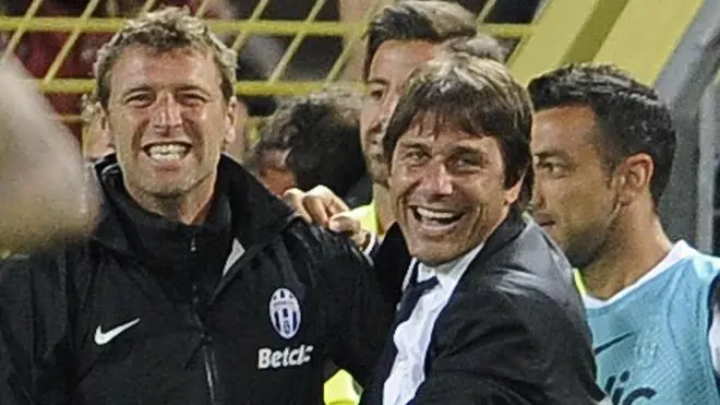 Italian head coach Antonio Conte (R) of Fc Juventus celebrates with his assistent Massimo Carrera (L) during Italian Serie A soccer match between Cagliari and Juventus at Nereo Rocco Stadium in Trieste,Italy, 6 May 2012. ANSA/MAURIZIO BRAMBATTI