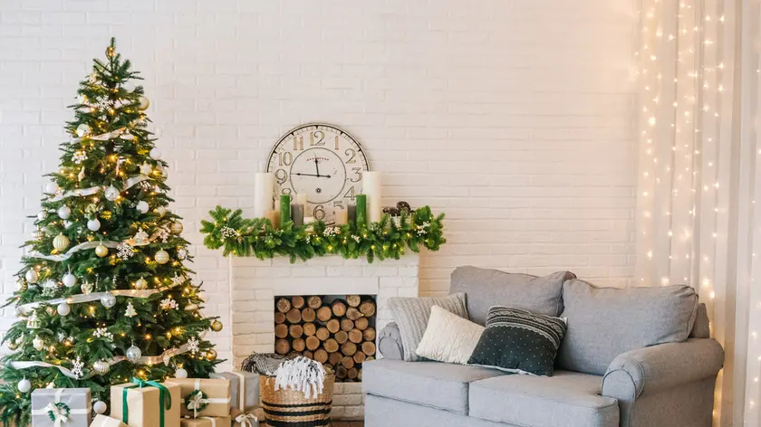 Christmas decorations and a garland on the tree with a home interior