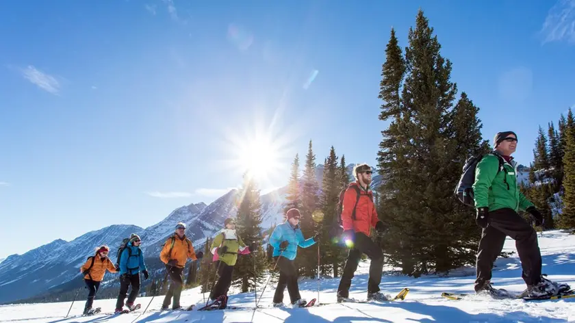 Group of people snowshoeing --- Image by © Graham Twomey/Ascent Xmedia/Corbis