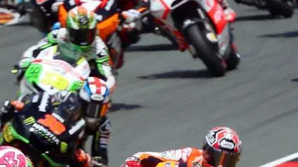 epa03787746 Italian MotoGP rider Valentino Rossi (front) of the Yamaha Factory Racing team leads the pack during the Motorcycling Grand Prix of Germany at the Sachsenring circuit near Hohenstein-Ernstthal, Germany, 14 July 2013. EPA/JAN WOITAS