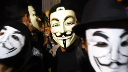 Activists wear Guy Fawkes masks during New Year's Eve celebrations at Independence Square in Kuala Lumpur, Malaysia, Saturday, Dec. 31, 2011. (AP Photo/Lai Seng Sin)